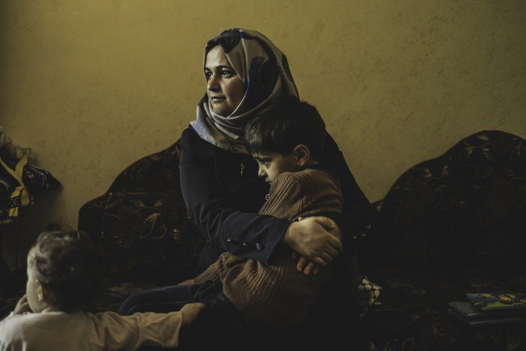 Kifah was pregnant with her first child when around 4 am she started feeling birth contractions. It was a cold night with temperatures at around -3 degrees Celsius. In order to reach a hospital, Kifah and her husband had to cross a checkpoint, but were denied permission to pass. As her husband tried to convince the soldiers that his wife needed to reach the hospital urgently, Kifah fell to the ground and started giving birth. As soon as the baby's head started coming out, the soldiers allowed them to cross to the other side where an ambulance was waiting. Kifah gave birth to her son at the checkpoint, causing him irreparable brain damage.
